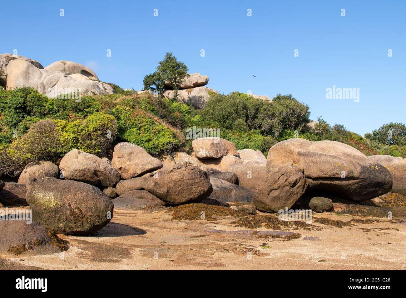 Boulders on the Cote de Granit Rose - Pink Granite Coast - in Brittany, France Stock Photo