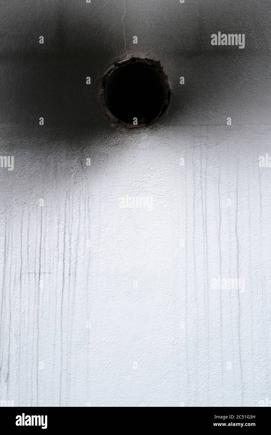 A Close Up Abstract Shot Of A Ventilation Hole In The Exterior Wall Of A Take Away Shop Stock Photo
