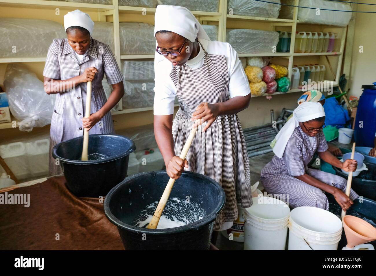 Young candidates of the Order of the 'Handmaids of the Divine Redeemer' (HDR) in their own soap and shampoo production in the Catholic Novitiate Koforidoa, Ghana, Africa Stock Photo