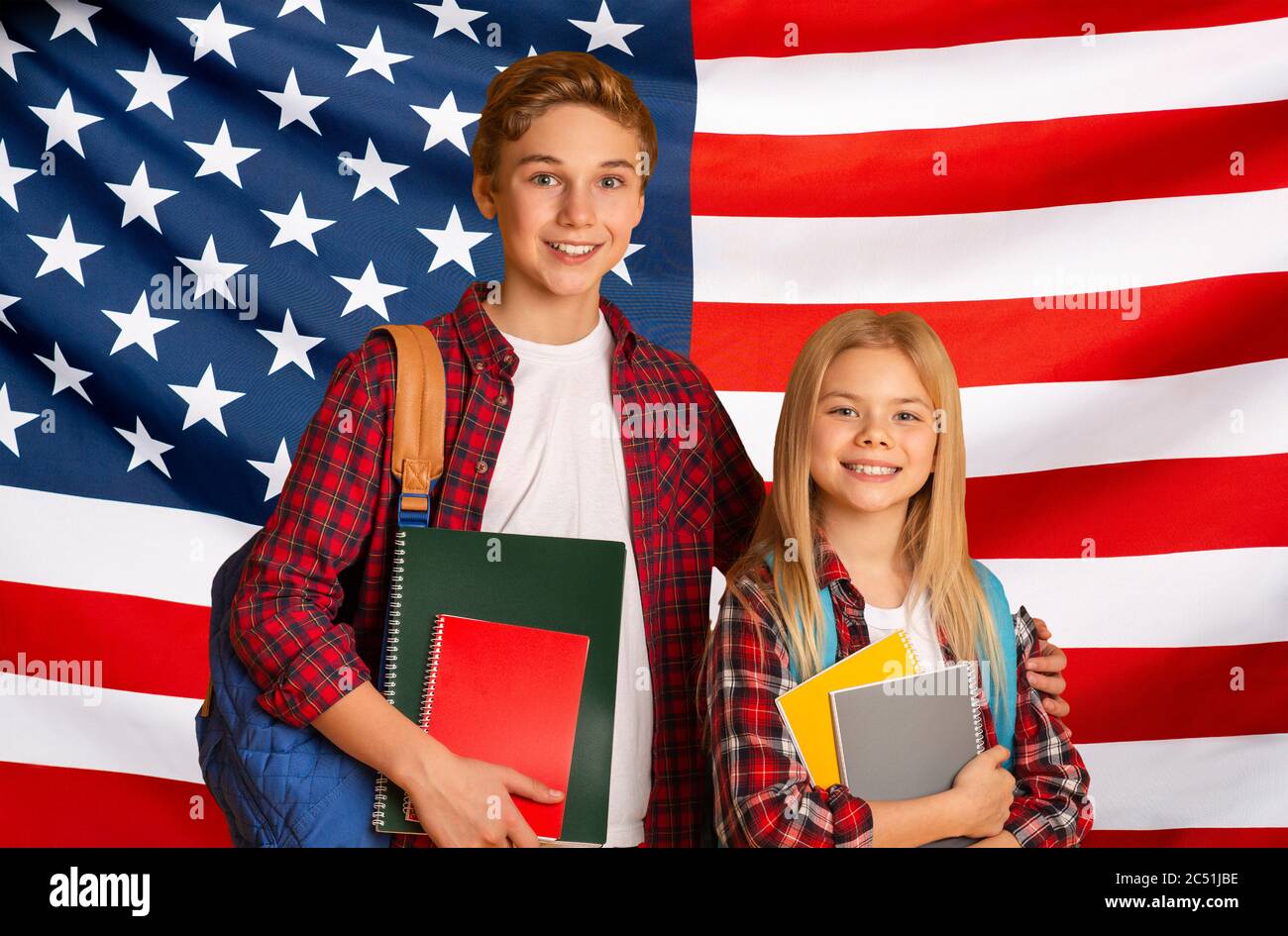 Education In USA. Happy kids with backpacks posing over American flag ...
