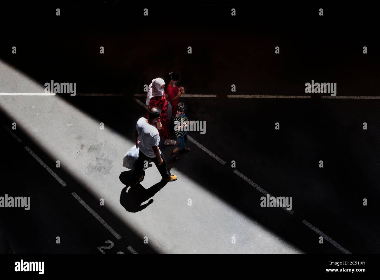 Arab family walking in Encants market, Barcelona. Stock Photo