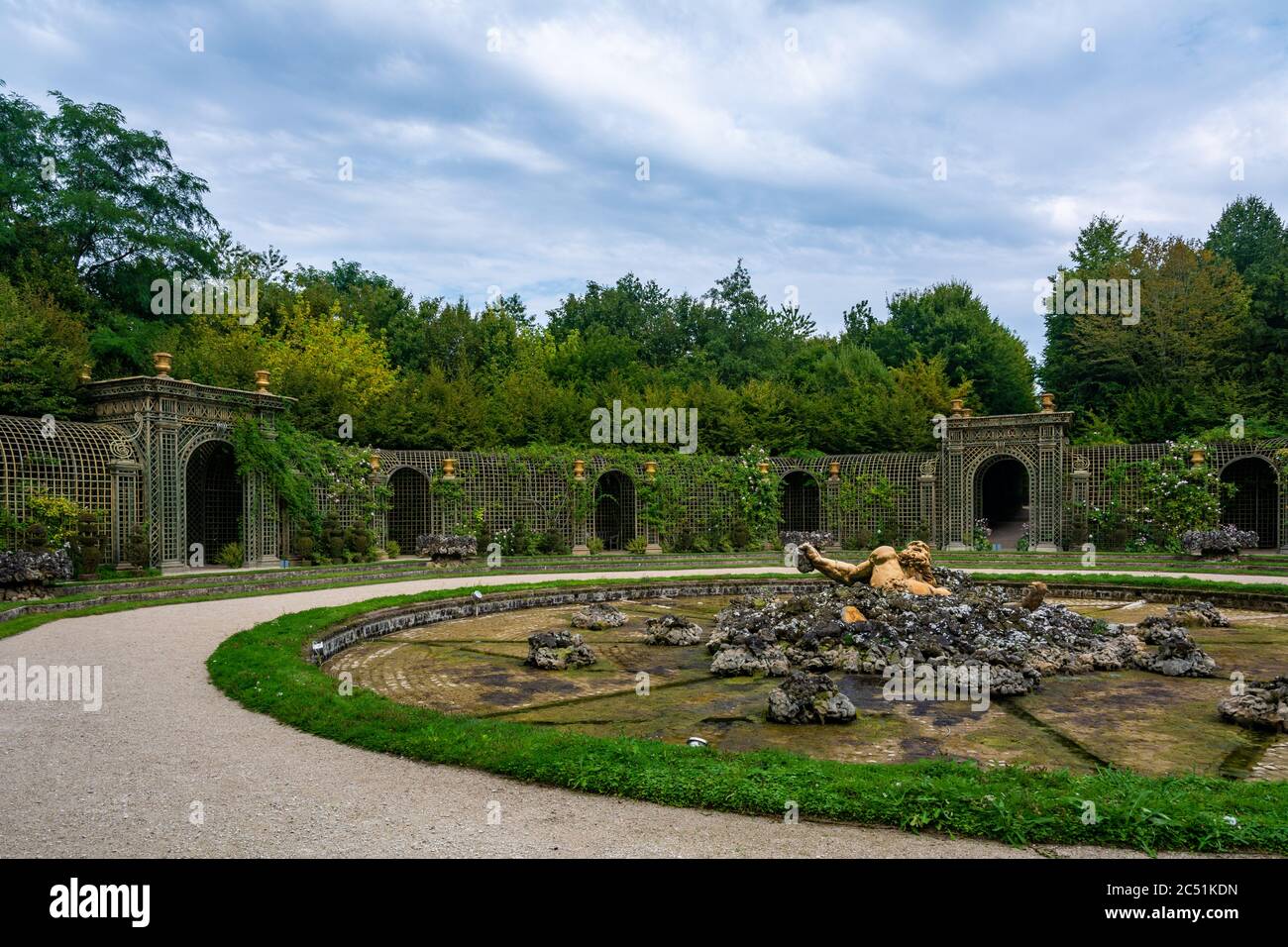 Versailles, France - August 27, 2019 : Enceladus Grove in the park of Versailles Palace with a fountain and Encelade under the rocks. Stock Photo