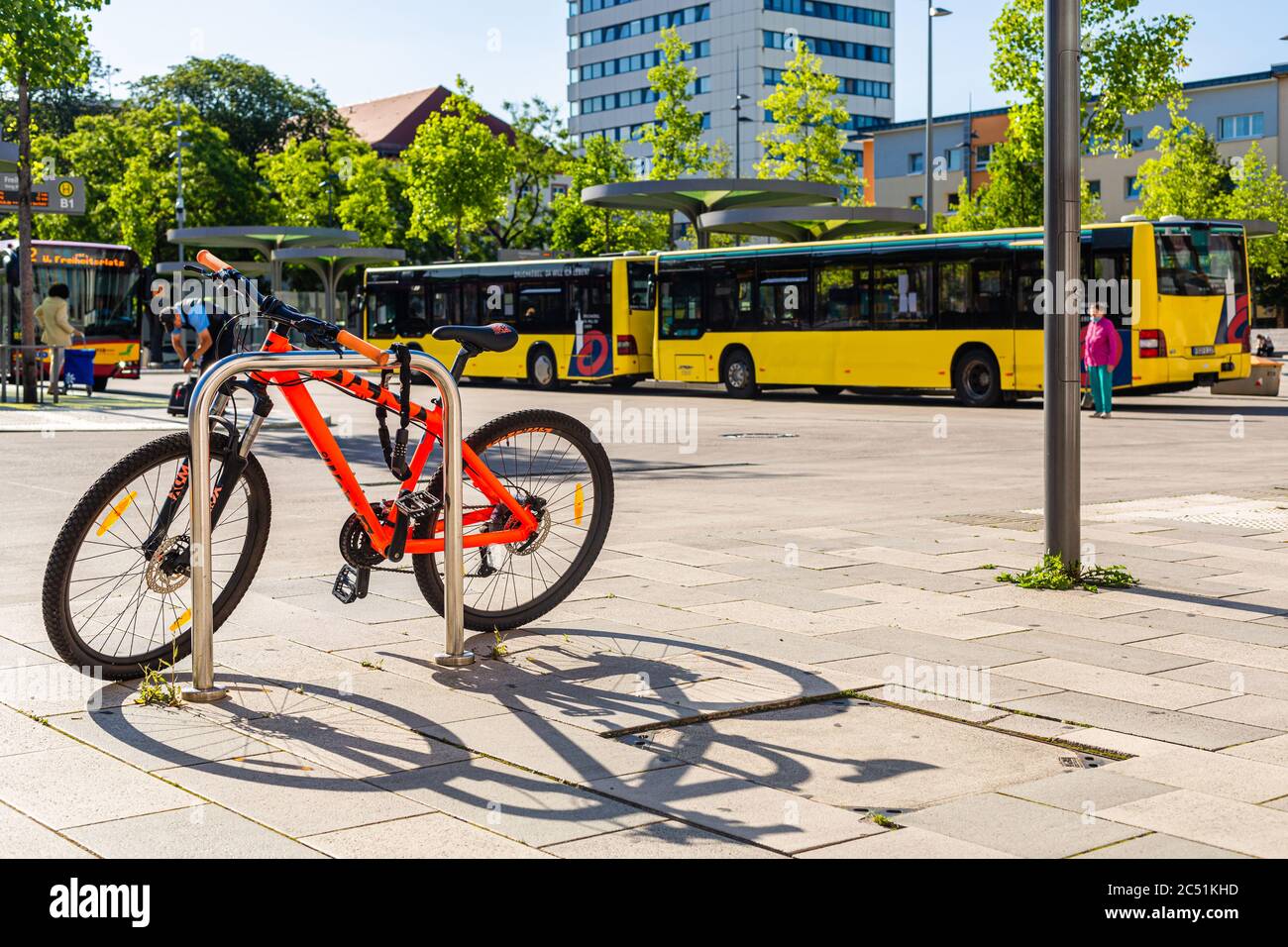 Yellow buses. Public transport in Germany. Last station. Summer in city. Parked buses. Stock Photo