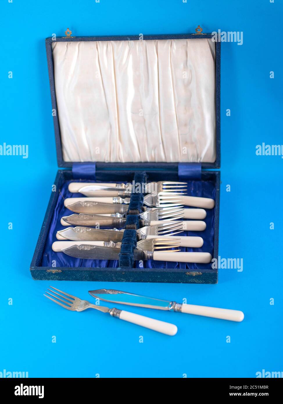 vintage canteen of cutlery on plain studio background Stock Photo