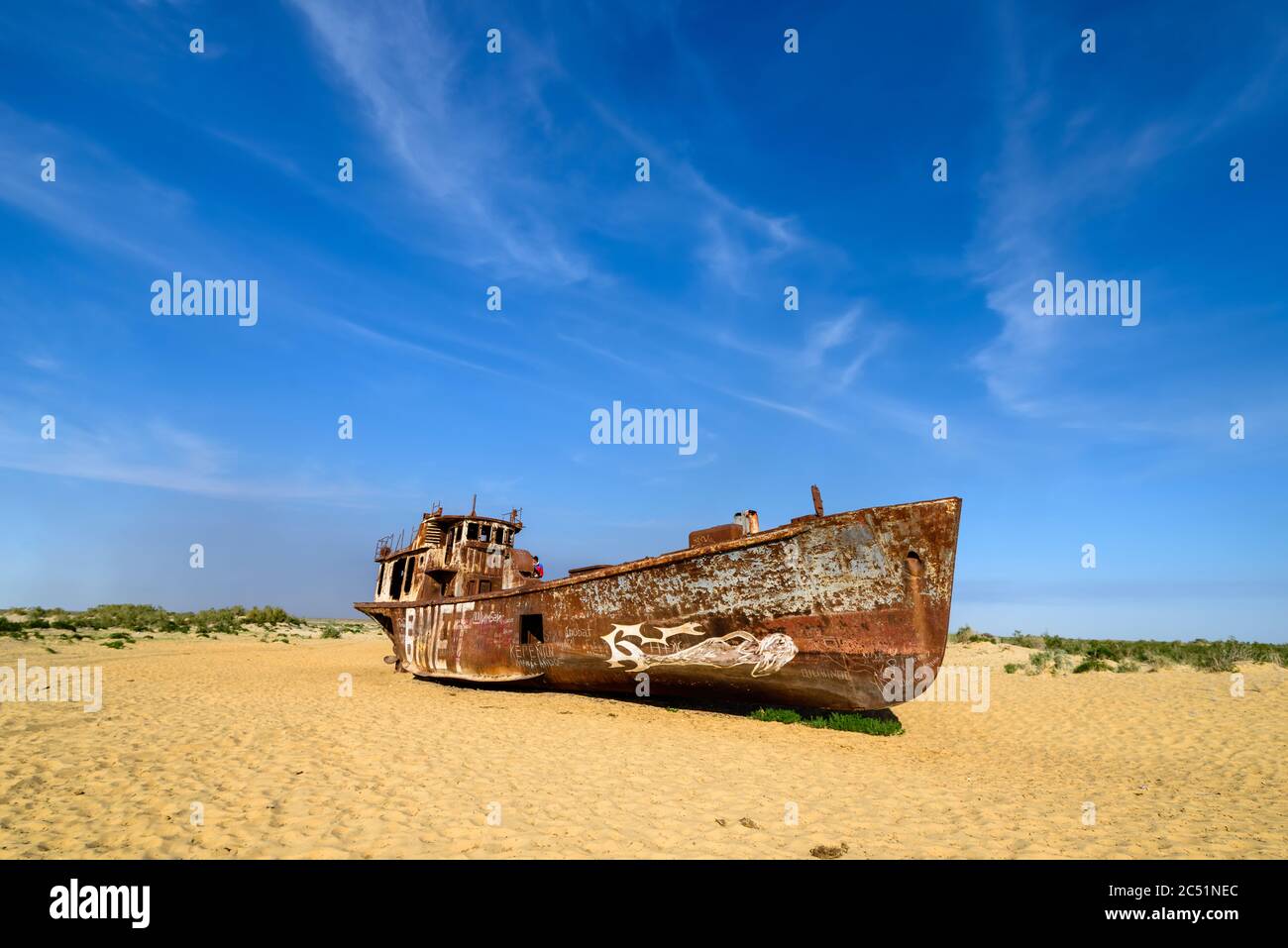 Moynaq, Uzbekistan - 08 May 2019: Rusting ships on the dry Aral sea in Uzbekistan in Moynaq Stock Photo