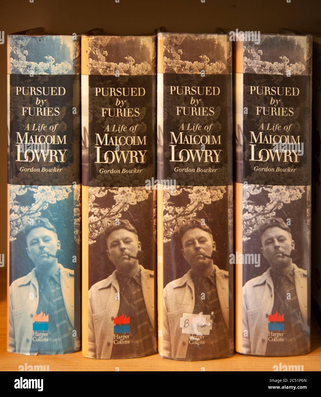 Pursued by Furies, a Life of Malcolm Lowry by Gordon Bowker, four hardback books in a row Stock Photo