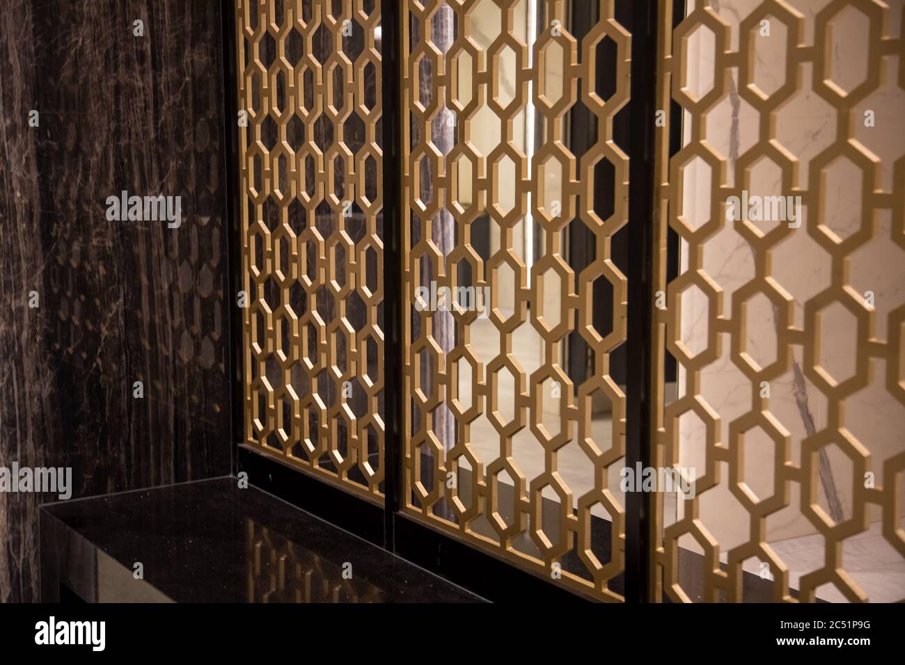 Close-up of a golden design fence. room partition. Stock Photo