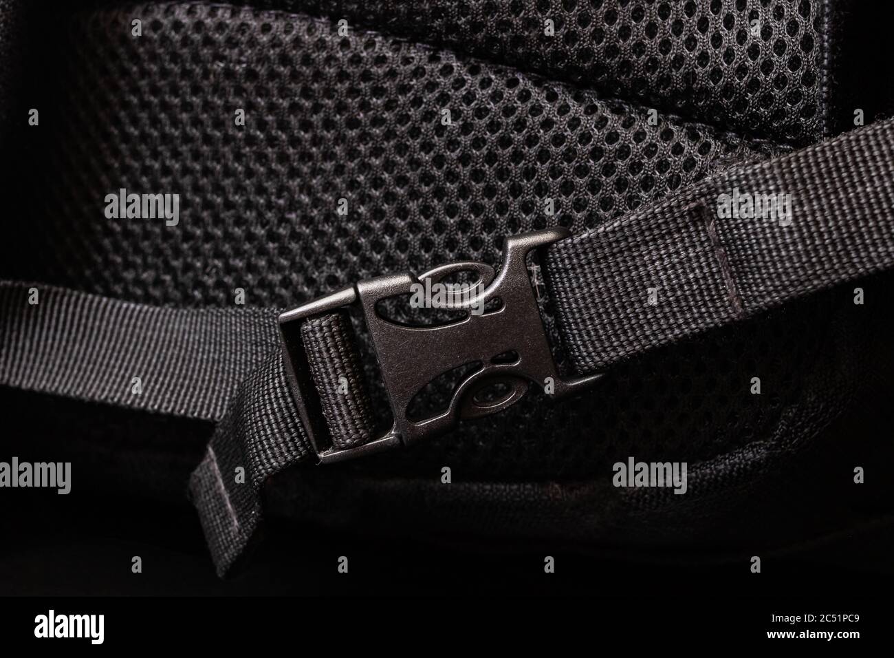 Plastic clasp on a black backpack closeup Stock Photo