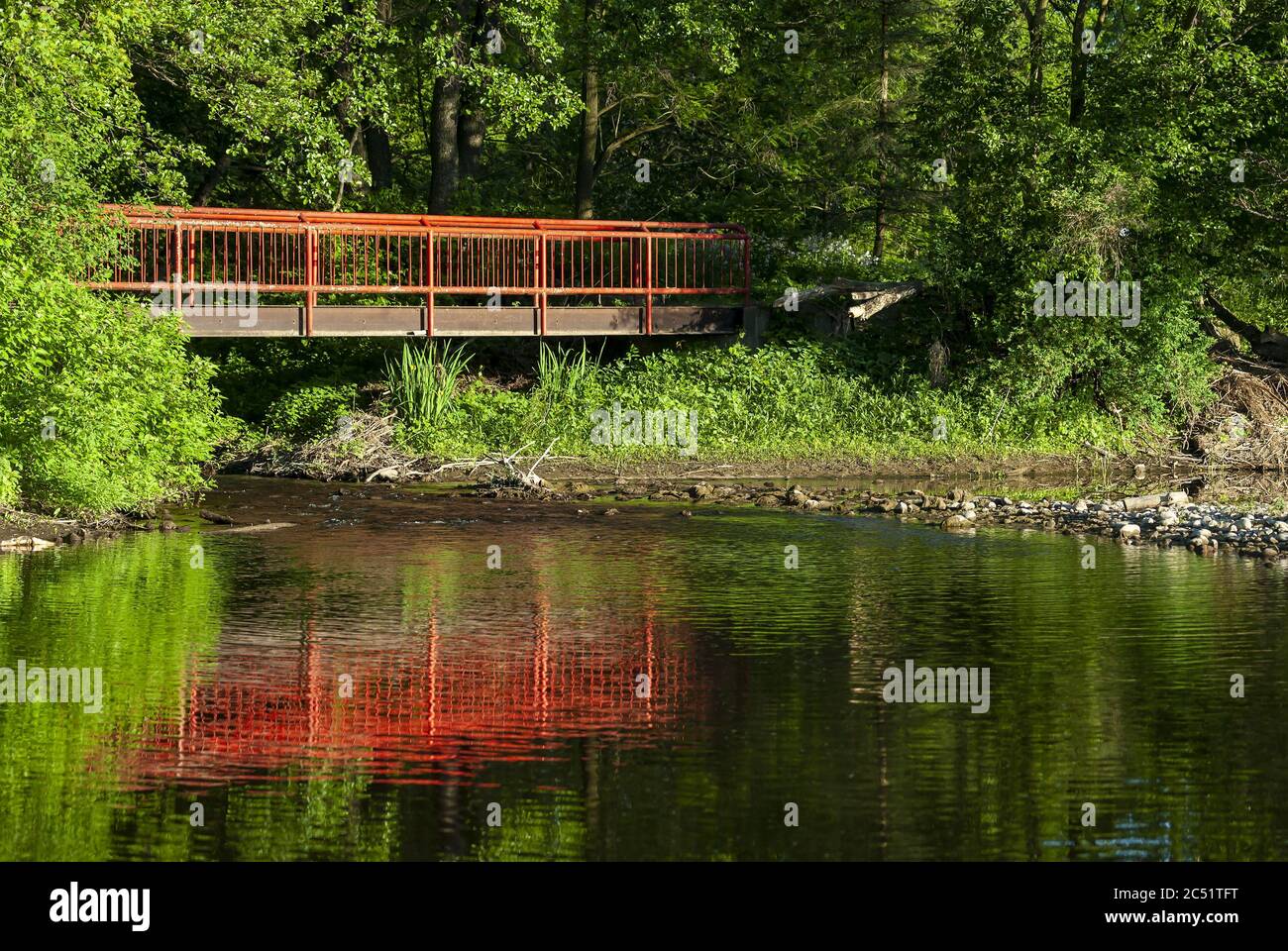 Old red bridge crossing the river Stock Photo Alamy