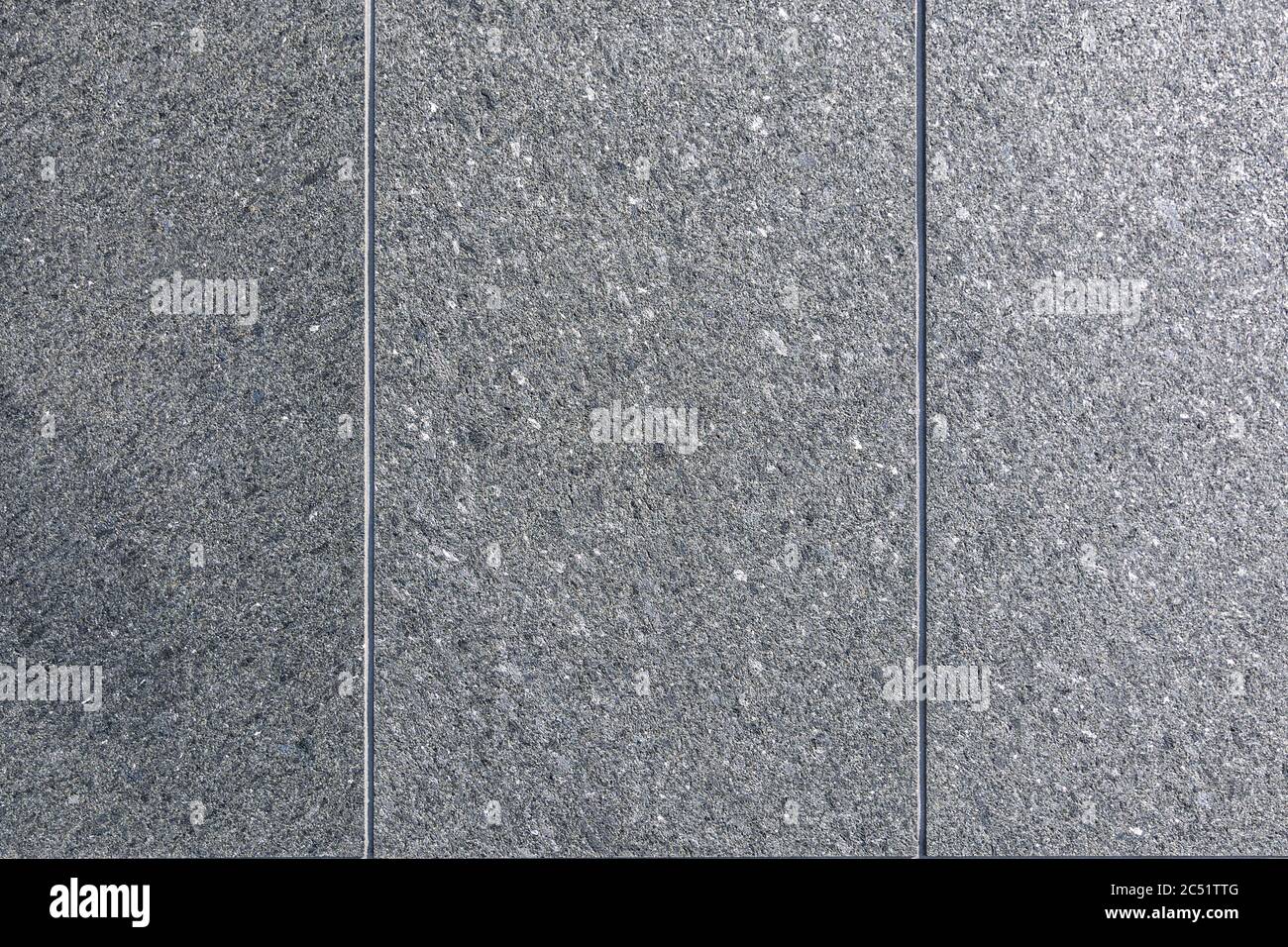 Background rough grey concrete wall with vertical lines Stock Photo