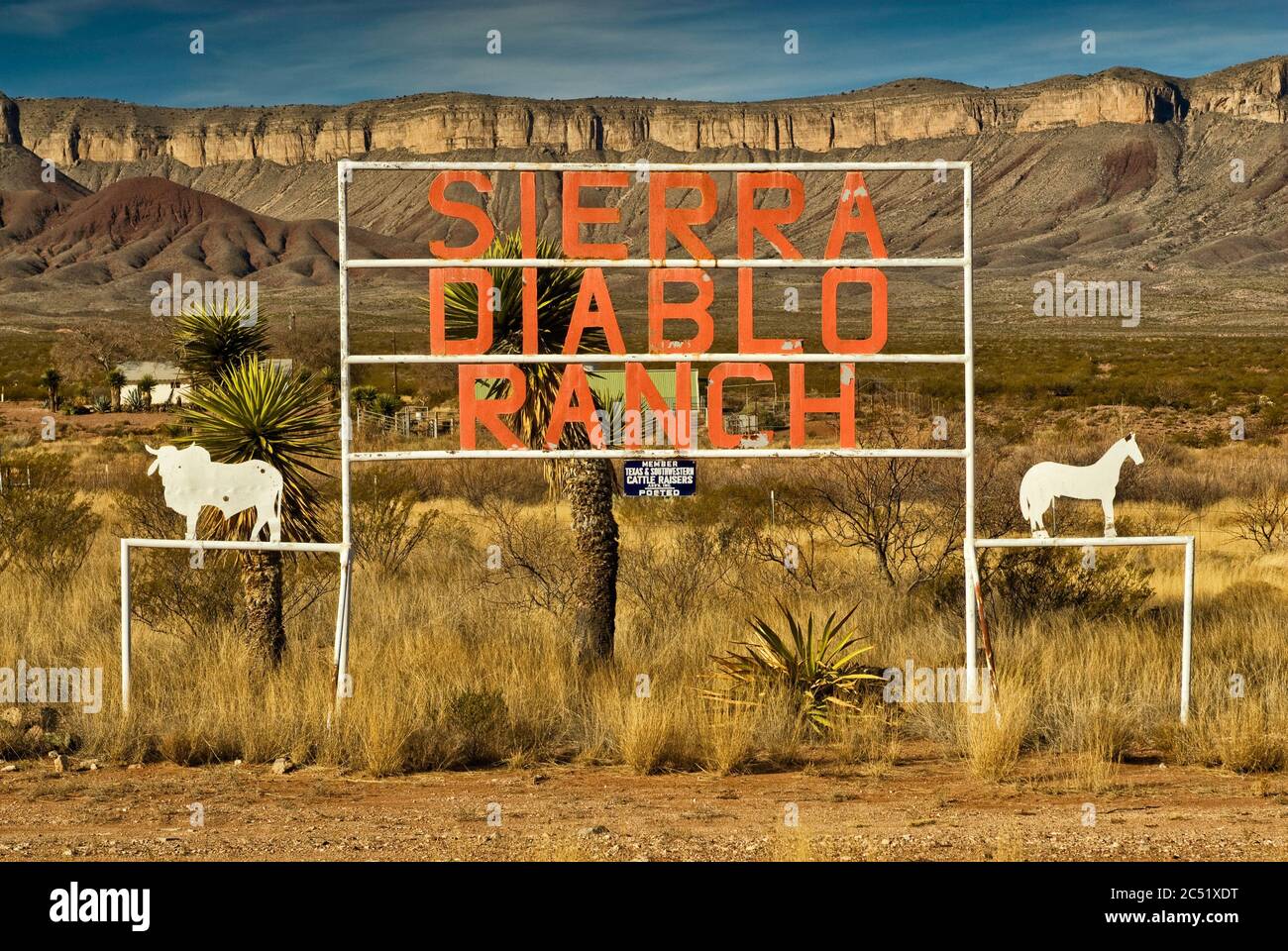 Ranch sign at prairie in Big Bend Country with Sierra Diablo mountain