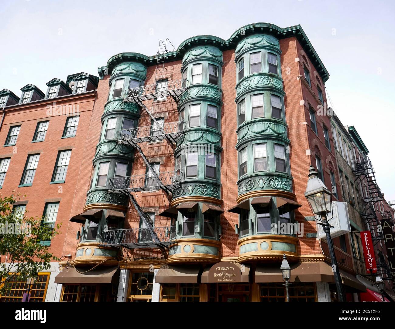 Historic apartment building with bay windows and Gennaro's Italian