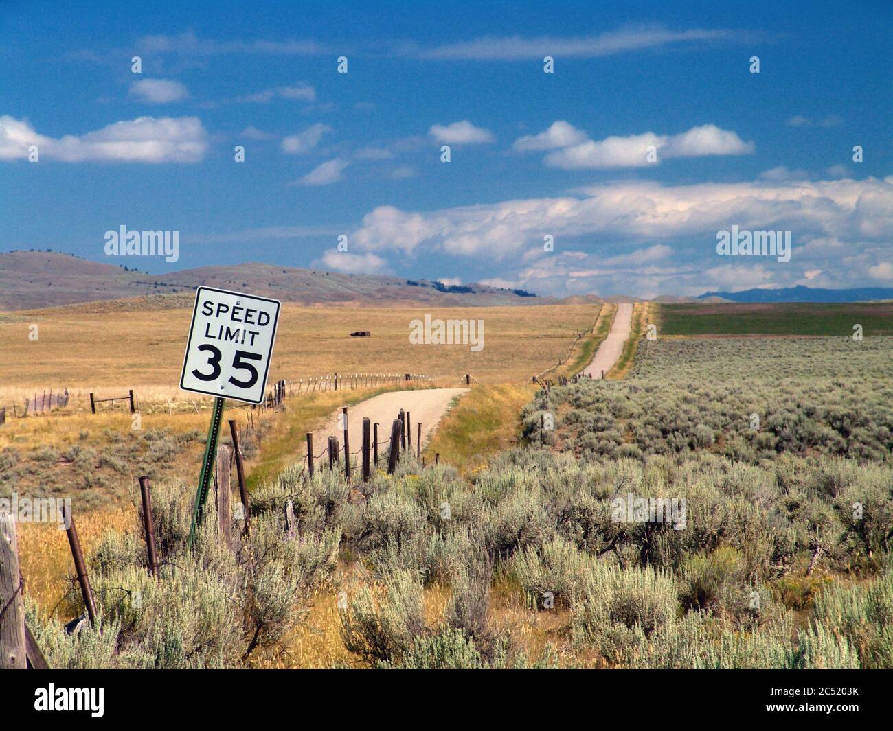 Empty country road with a speed limit of 35 mph in Montana, USA Stock