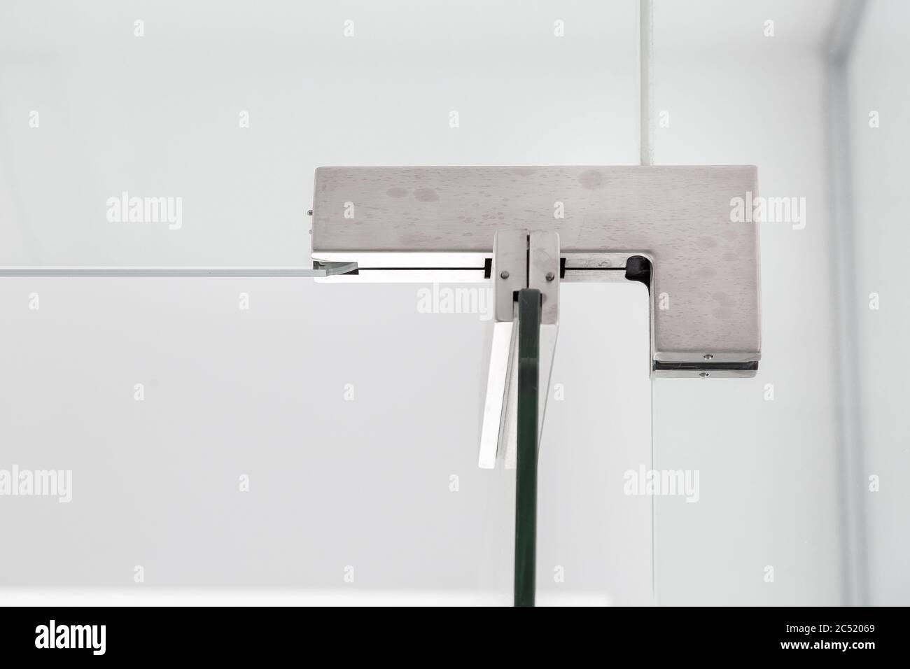 glass door hinges to bathroom, close up of hinged accessories of