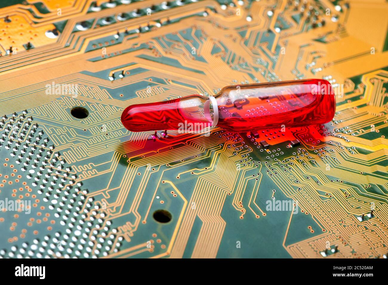 Glass transparent ampoule with red liquid modern medicine using electronic  methods and cyber printed silicone circuit boards, close-up Stock Photo -  Alamy