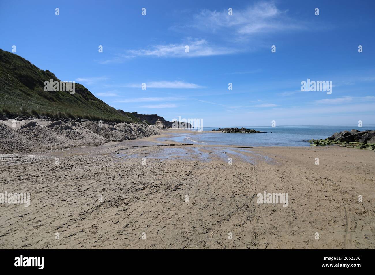 Beautiful scenery of a sandy beach in Lonstrup, Denmark under a blue ...
