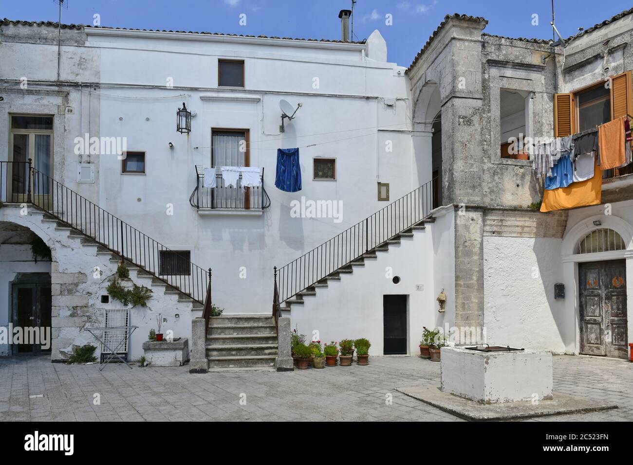 A narrow street in the old town of Monte Sant'Angelo, Italy. Stock Photo