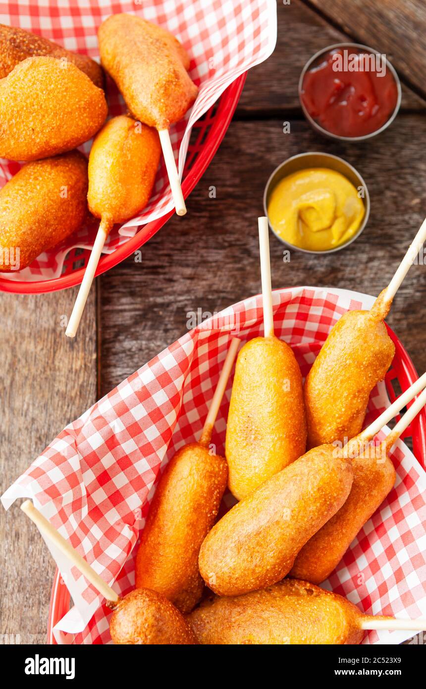 Corn Dogs, little deep fried sausages on sticks Stock Photo Alamy