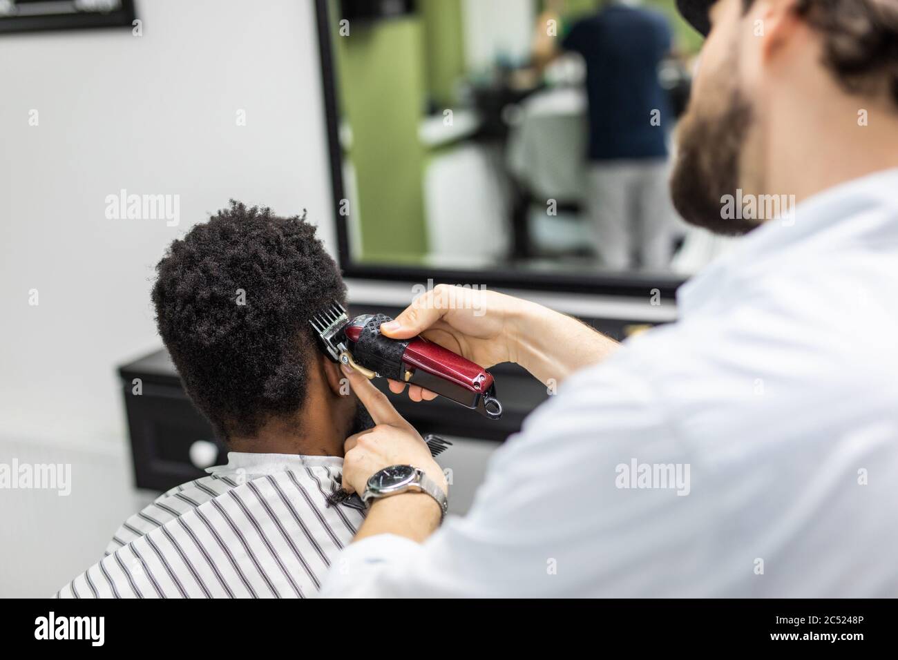 A Barber is Going through the Electric Cutting and Shaving Machine for the  Beard of an African-American Brazilian Boy Stock Image - Image of beauty,  business: 214303807