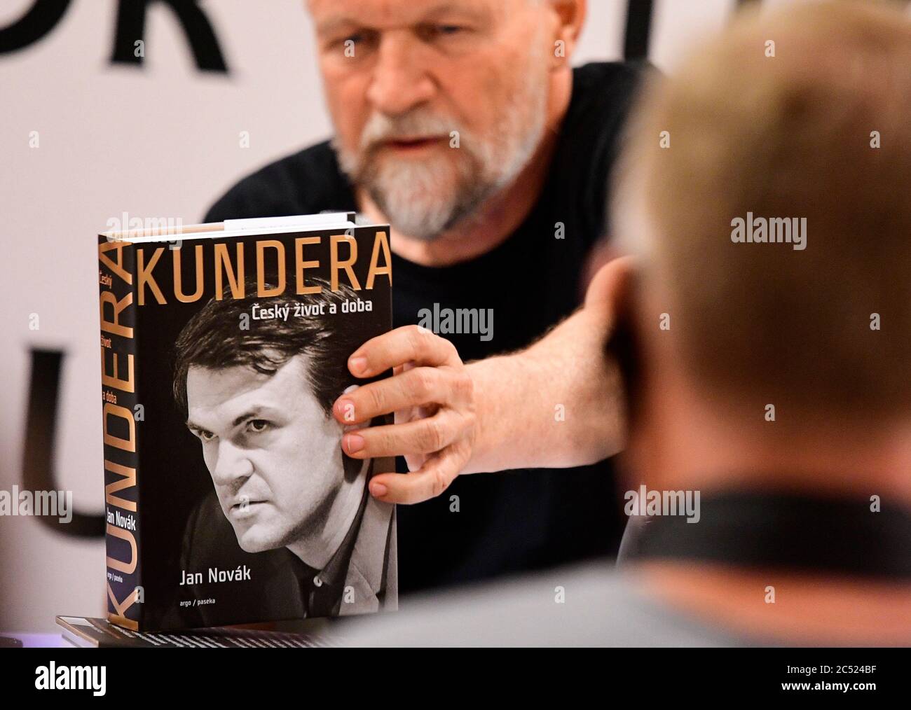 Prague, Czech Republic. 29th June, 2020. Czech author Jan Novak poses with his new literary biography of Czech-born writer living in France Milan Kundera, 91, called Kundera: The Czech Life and Times, on June 29, 2020, in Prague, Czech Republic. Novak worked on the biographical novel for four years. But he did not talk to Kundera since the writer, living in Paris for 45 years, did not react to Novak's requests for consultations. Credit: Katerina Sulova/CTK Photo/Alamy Live News Stock Photo