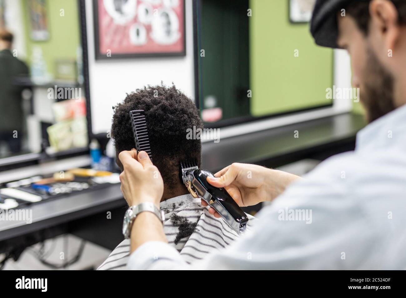 Portrait Of Young Black Man In Barbershop Handsome African Guy Makes New Haircut In Barber Shop Salon Stock Photo Alamy
