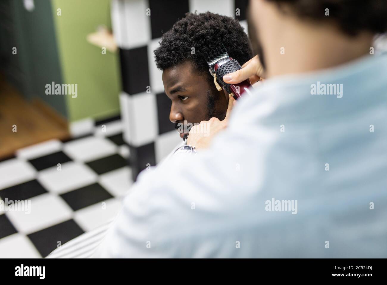 Portrait Of Young Black Man In Barbershop Handsome African Guy Makes New Haircut In Barber Shop Salon Stock Photo Alamy