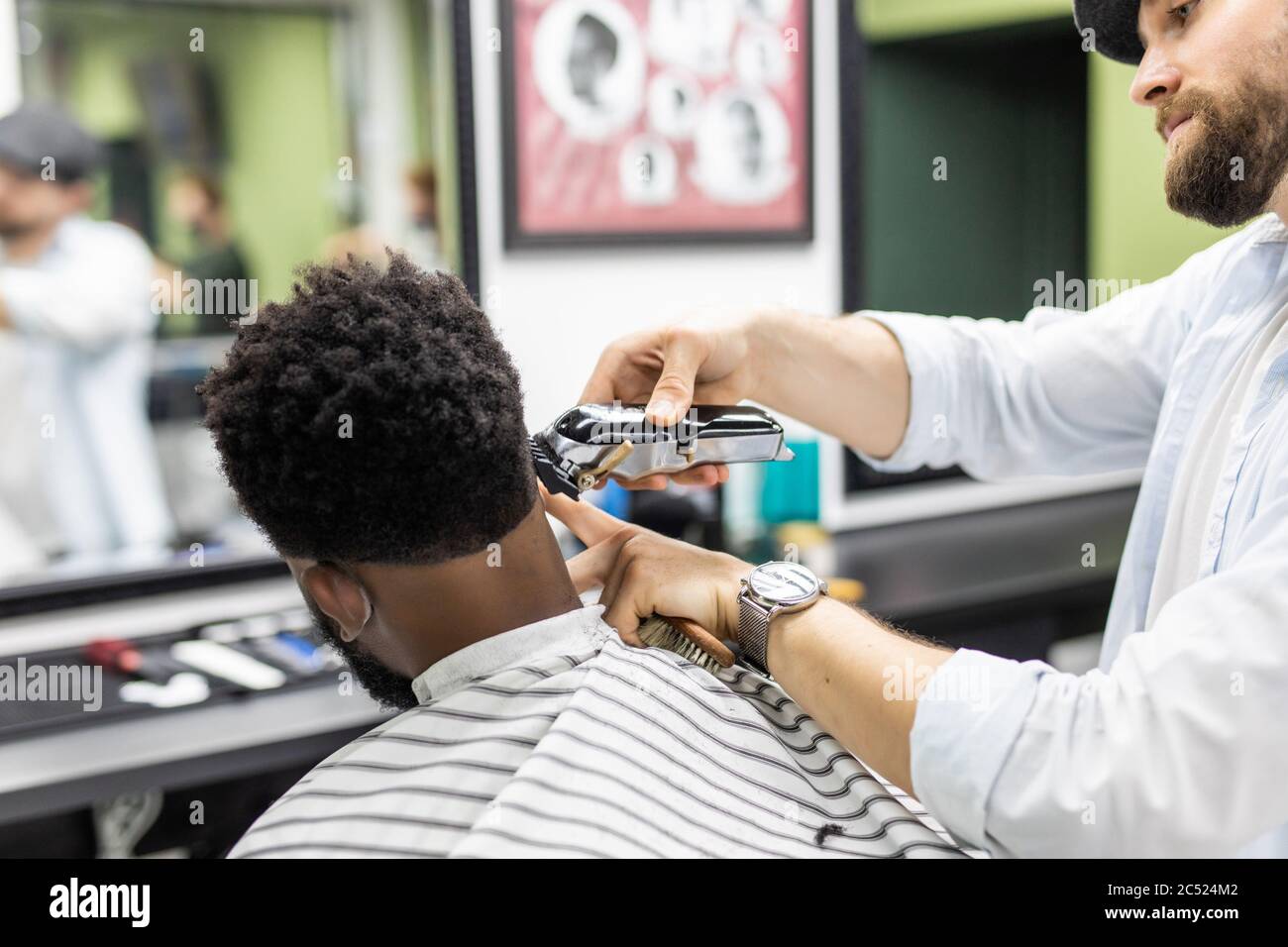 cutting black man's hair with clippers