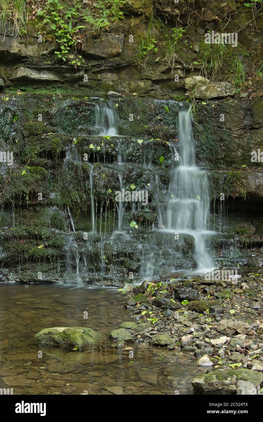 A small waterfall at the base of  Scaleber Force, Settle, Yorkshire Dales, UK Stock Photo