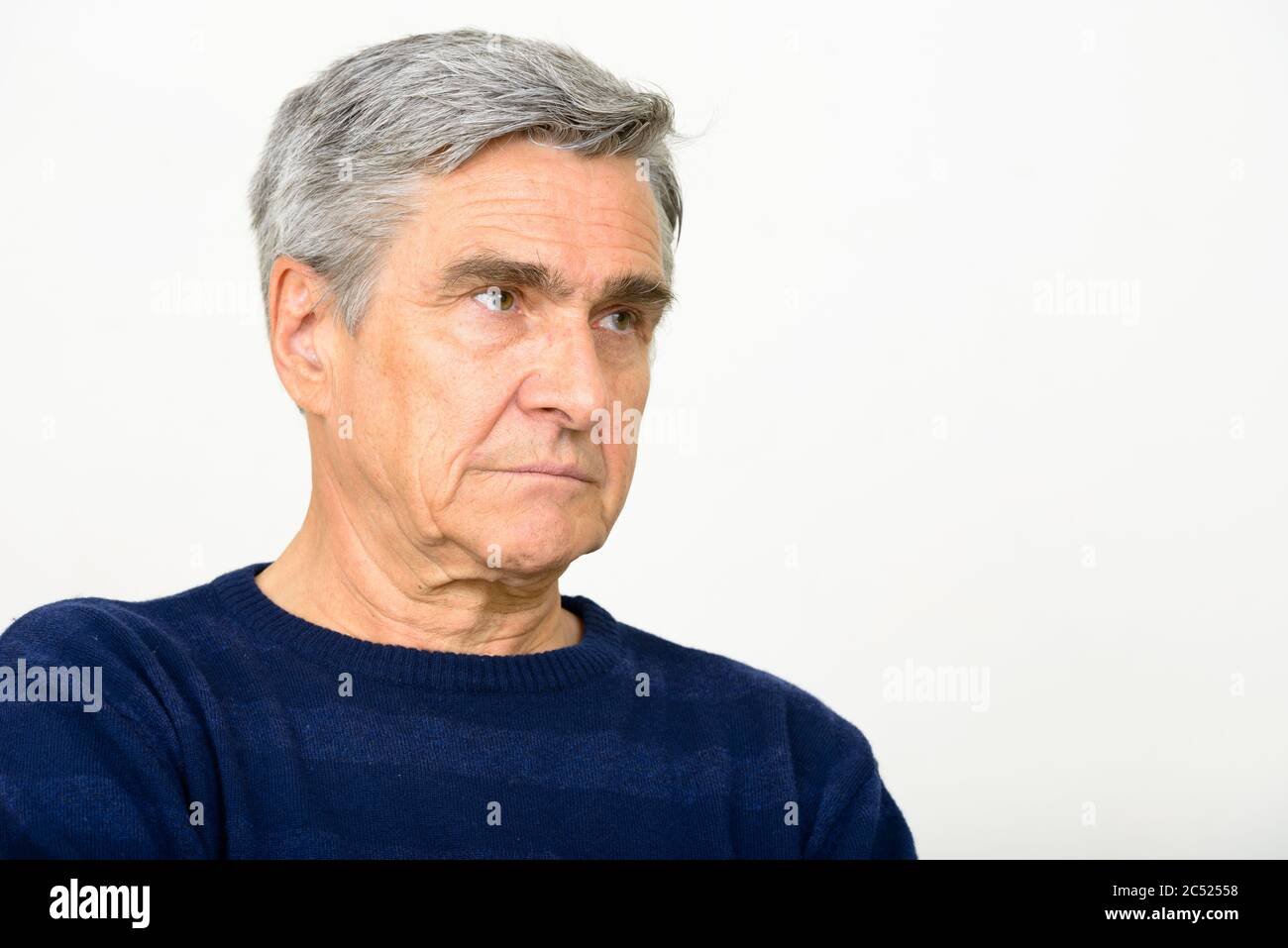 Face of handsome senior man thinking and looking away Stock Photo - Alamy