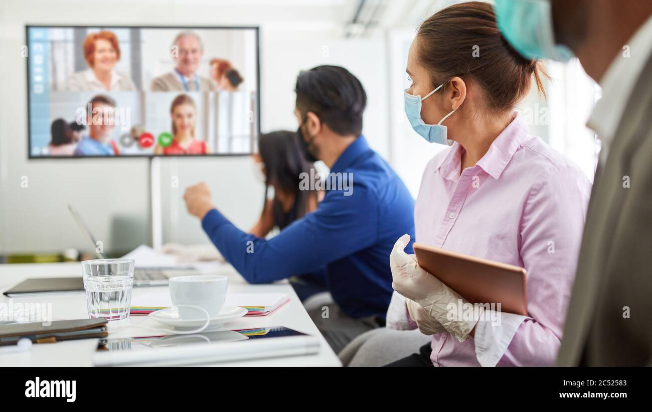 Conference call with video conference for Business Team Meeting in Covid-19 and Coronavirus Pandemie Stock Photo