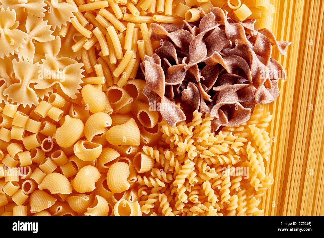 Heap of various raw pasta or macaroni in different types and shapes