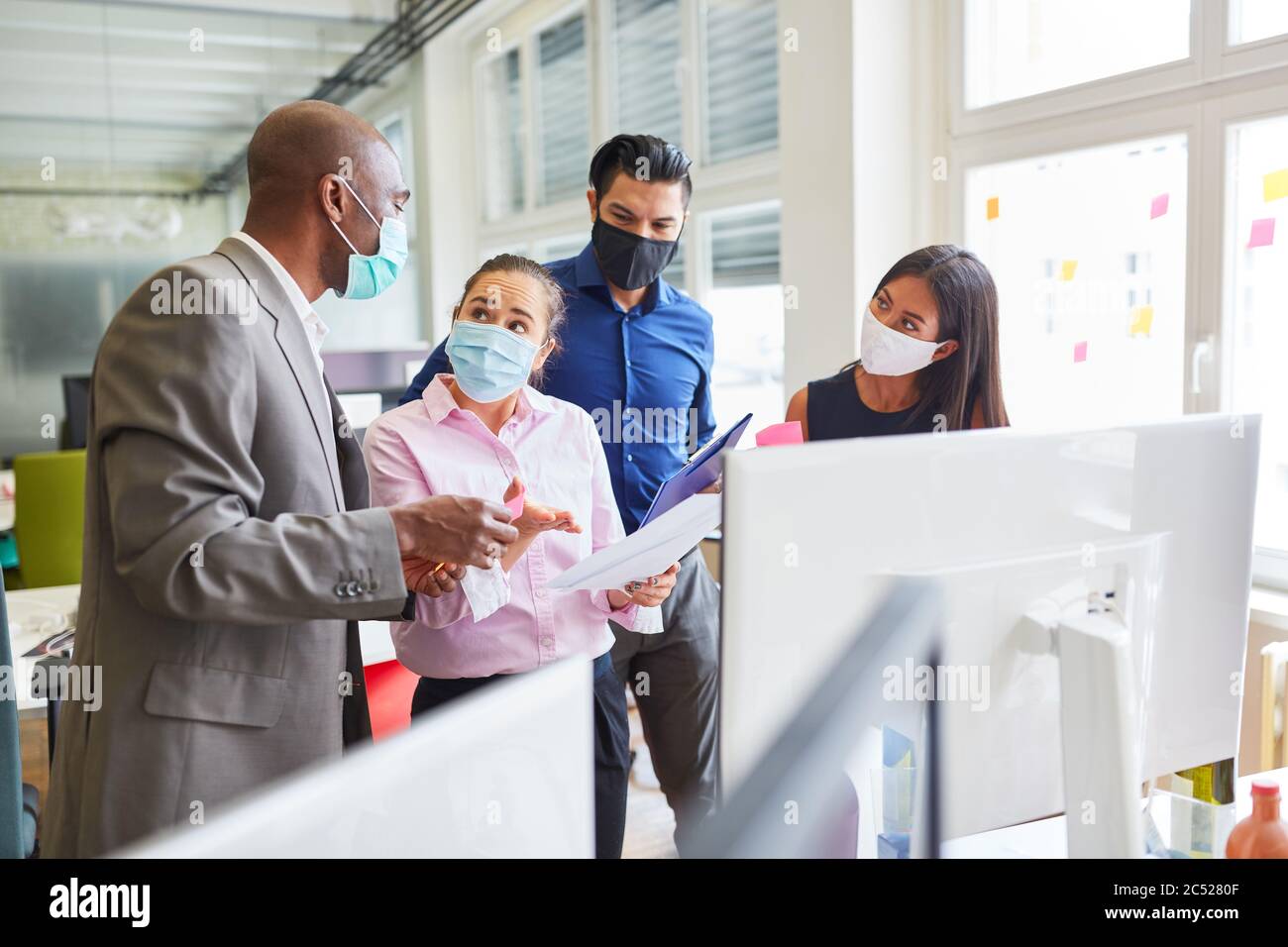 African businessman as a consultant consulting with the creative team of a web agency Stock Photo