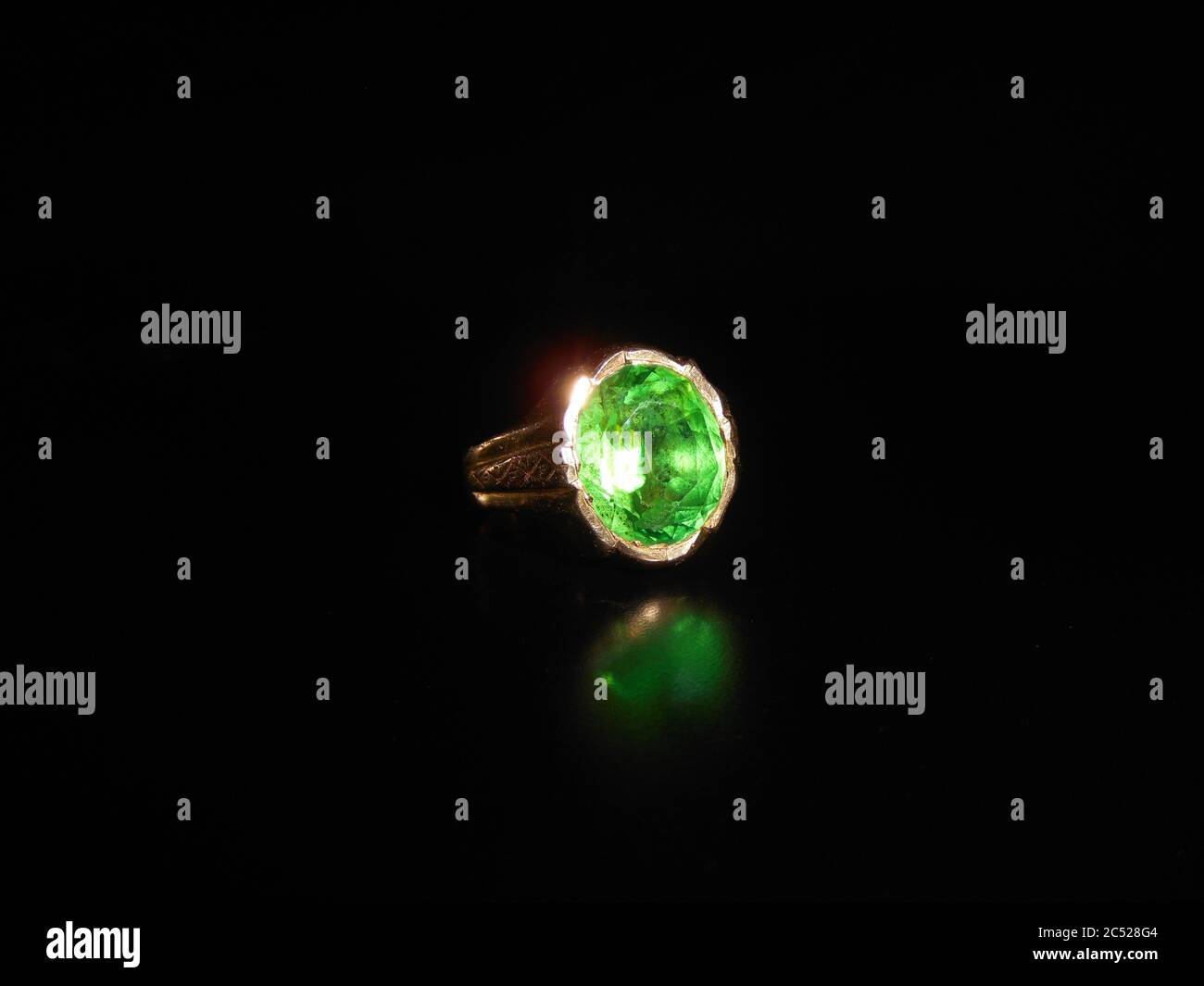 Women's Sparkling Ruby Fashion Ring on black background. Stock Photo