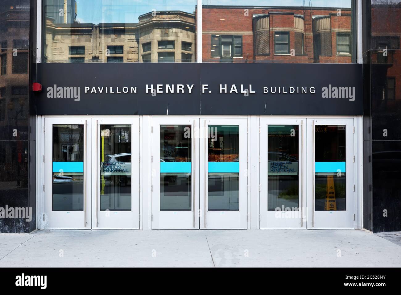 Montreal, Canada - June, 2018: The entrance door and banner sign of Henry F. Hall building of Concordia University in  Montreal, Quebec, Canada Stock Photo