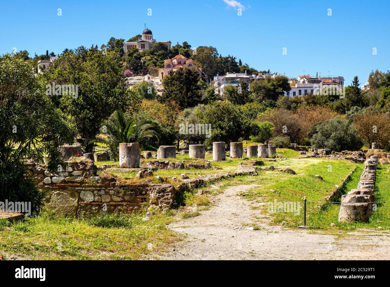 Athens, Attica / Greece - 2018/04/02: Panoramic view of ancient Athenian Agora archeological area with National Observatory building atop Nymphon Hill Stock Photo