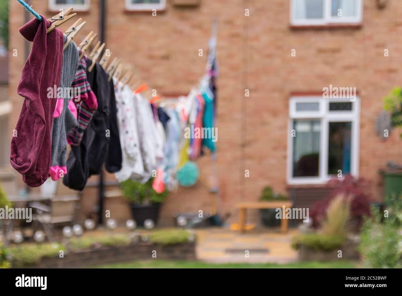 Washing hanging on long line drying in the gusty windy weather. Full