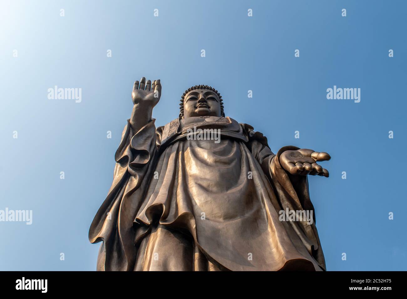 Buddha statue with blue sky background in China Stock Photo - Alamy