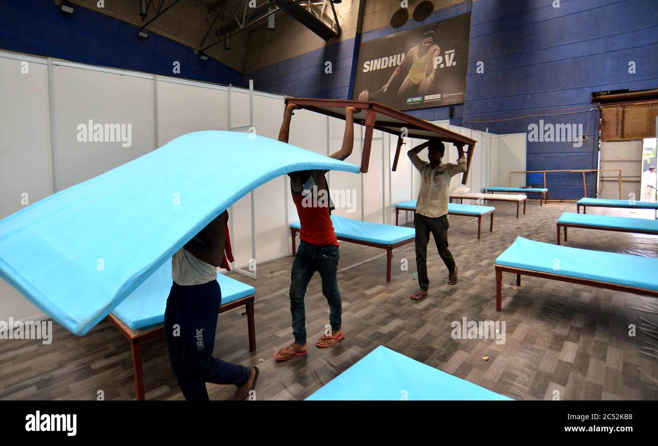 New Delhi, India. 30th June, 2020. Workers set up a converted field hospital as the numbers of COVID-19 cases rise in New Delhi, India, on June 30, 2020. Credit: Partha Sarkar/Xinhua/Alamy Live News Stock Photo