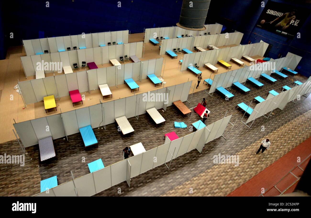 New Delhi, India. 30th June, 2020. Workers set up a converted field hospital as the numbers of COVID-19 cases rise in New Delhi, India, on June 30, 2020. Credit: Partha Sarkar/Xinhua/Alamy Live News Stock Photo