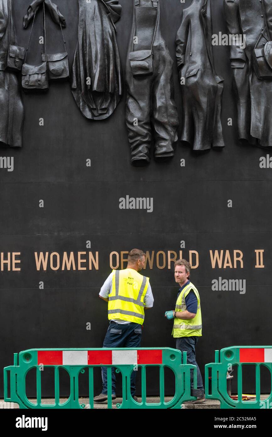 London 30th June 2020 Workers clean the memorial to "Women of World War II" in Westminster London Credit: Ian Davidson/Alamy Live News Stock Photo