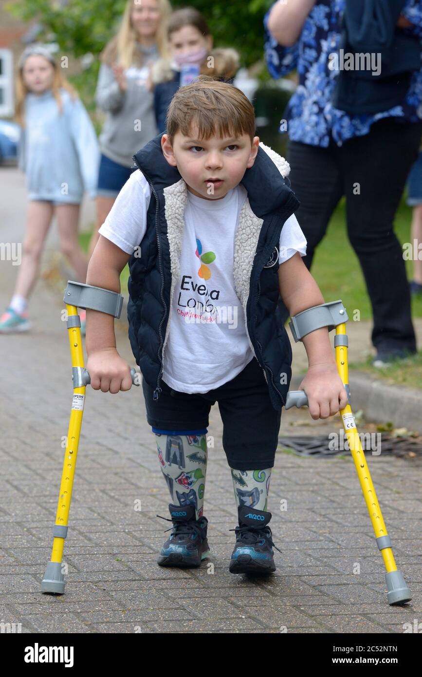 King's Hill, Kent, UK. 30th June, 2020. 5 year old Tony Hudgell finishes his last daily walk after covering more than 10km and raising more than £1,000,000 for the Evelina Hospital who saved his life and nursed him back to health after he had both legs amputated following abuse by his birth parents. Credit: PjrFoto/Alamy Live News Stock Photo