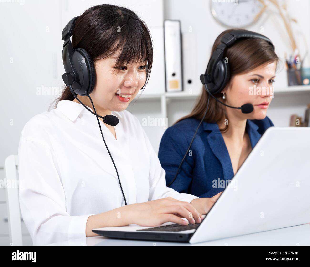 Operators working with computers in an office Stock Photo