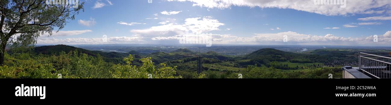 Panoramic view of green forest under blue sky and white clouds Stock ...