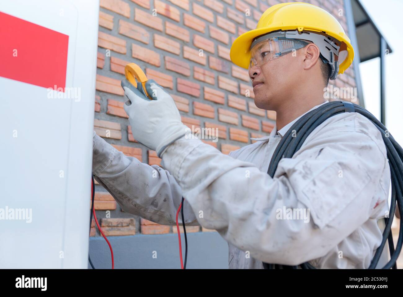 Engineer installing an air conditioning unit Stock Photo Alamy