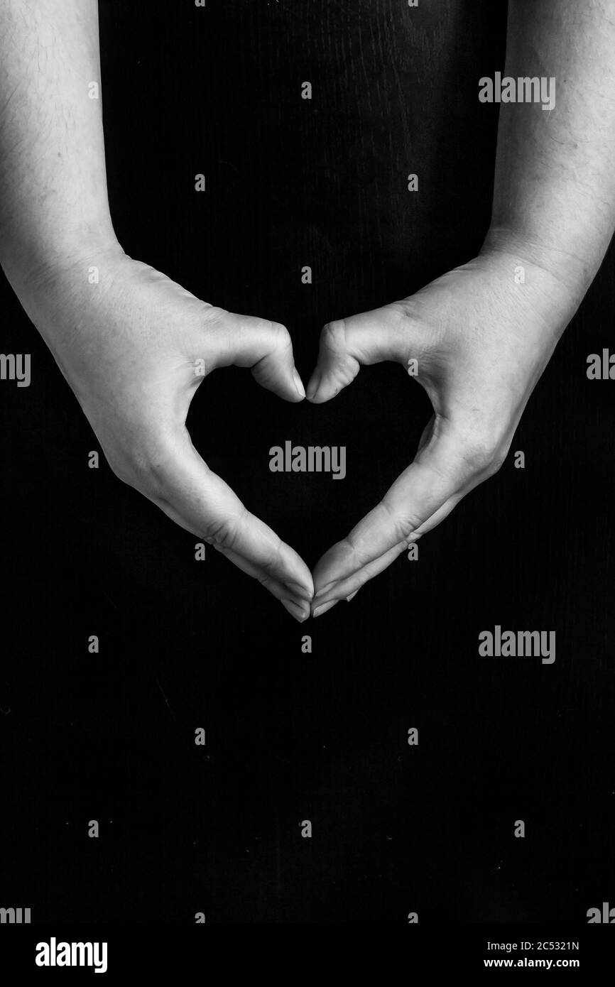 Black Lives Matter.hands folded in the form of a heart, on a black background Stock Photo