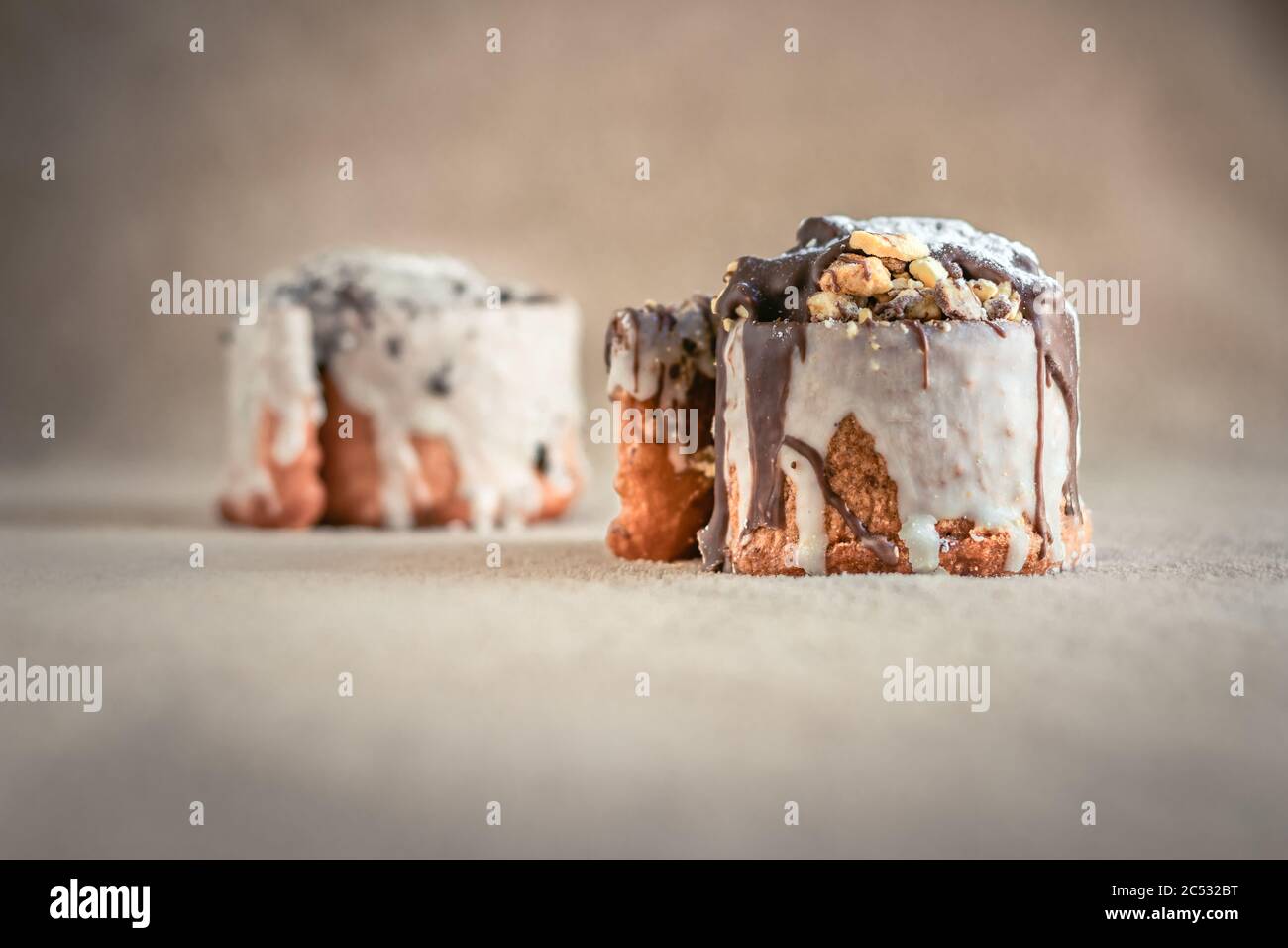 Brown and white chocolate pastry swirls with chocolate sprinkles Stock ...