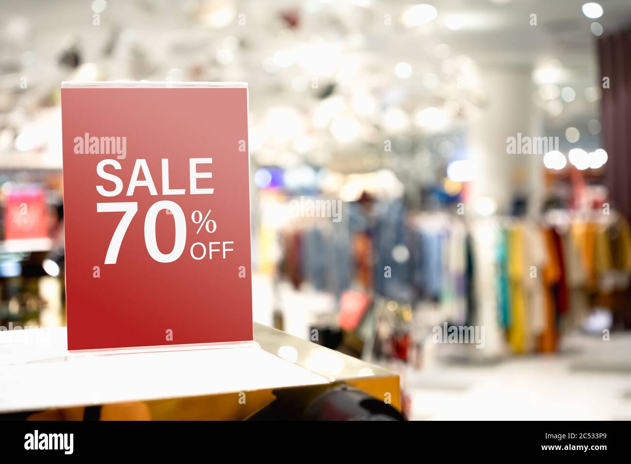 Sale label stand template on shelve in clothing store for sale
