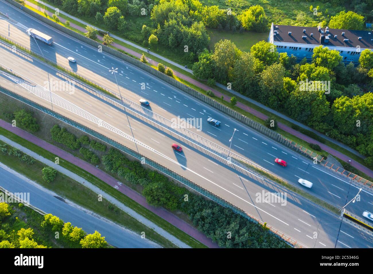 Aerial view of car driving through the forest on country road Stock ...