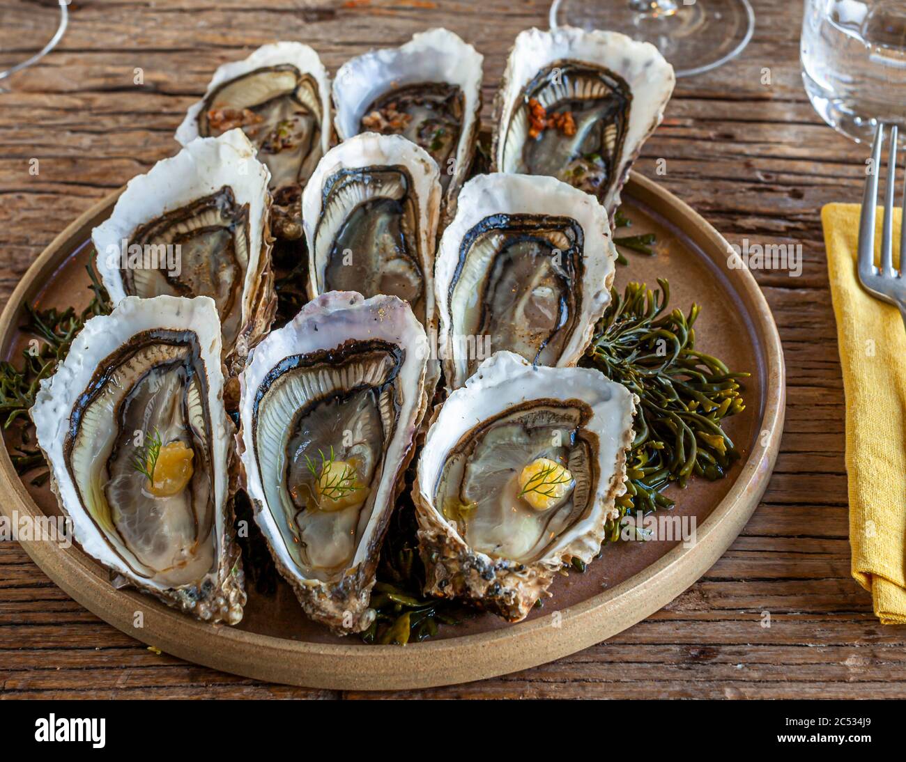 Nine oysters combined with three different spices and herbs. Entrée of Hugo Roellinger, Cancale Stock Photo