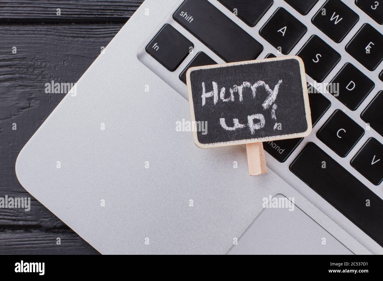 Laptop pc and hurry up message. Stock Photo